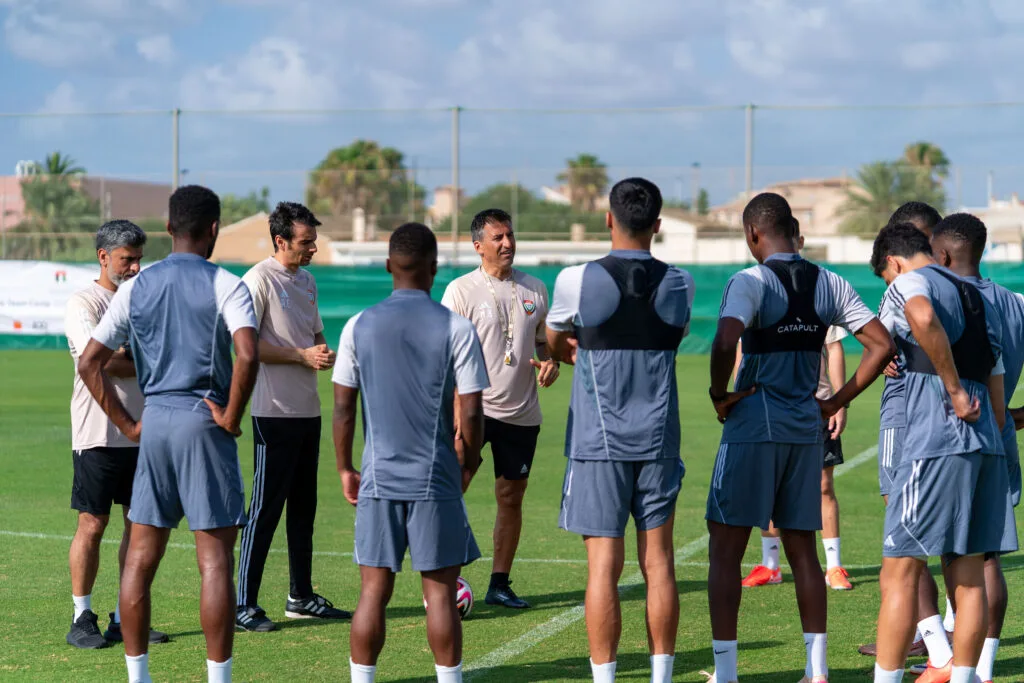 Football interpreter during a pre-training team meeting
